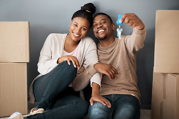 Image showing Real estate, property and African couple with keys to their new home, excited and moving. Home owner, happy and portrait of black man and woman show house keys with a smile, boxes and in an apartment