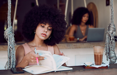 Image showing Books, writing and black woman relax at cafe, reading journal and working. Freelancer, remote worker and young female in coffee shop with cappuccino or espresso and notebook for journalism ideas.