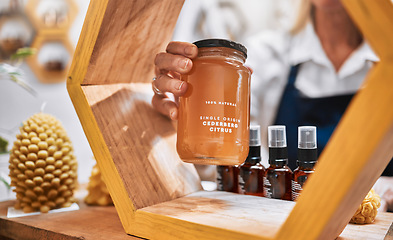 Image showing Honey, product and retail with hands of woman and display shelf for grocery, natural and health food. Wellness, trader and organic with small business owner for sustainability, supermarket and store