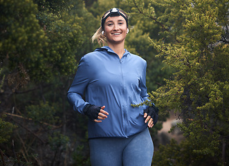 Image showing Woman, hiking and portrait in forest with smile for fitness, health and wellness with happiness by trees. Girl, happy and woods hiker in nature for exercise, workout and training on travel in summer