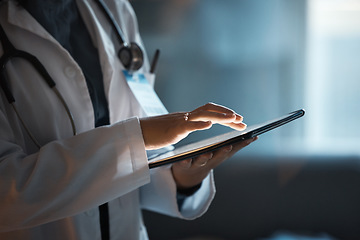 Image showing Telehealth, digital tablet and doctor hands for hospital innovation, software management and results update in dark workplace. Healthcare, cardiology and telecom medical professional with technology