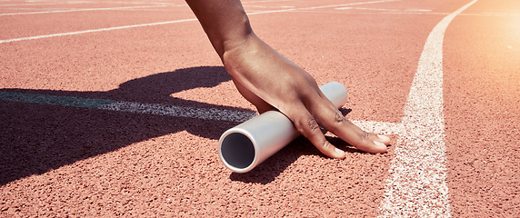Image showing Stadium start track, athlete hands and relay ready for runner competition, sports race and fitness exercise. Marathon training, asphalt wellness workout and woman hand with baton for running match