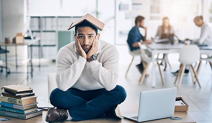 Image showing Laptop, books and businessman in training fail, burnout and stress with overwhelm workload in office, depression and tired. Corporate, business and sad man on a table, bored and moody while working