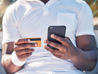 Image showing Black man, hands and phone with credit card for online banking, ecommerce or remote transaction. Hand of shopper using mobile smartphone and card for banking app, digital payment or wireless purchase