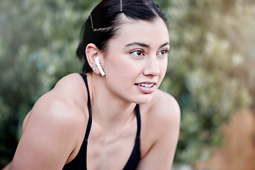 Image showing Fitness, podcast and woman in nature tired from running exercise, cardio workout or training for wellness. Runner, breathing or sports girl with fatigue relaxing or resting on break in park in Miami