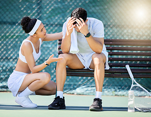 Image showing Tennis, sad and woman talking to man with stress, headache or head injury on outdoor court. Fitness, sports and girl athlete speaking to upset boyfriend for motivation, help and care on tennis court.