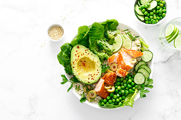 Image showing Salmon avocado bowl with broccoli, green peas, rice and fresh salad. Healthy food, top view