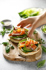 Image showing Salmon sandwiches with cream cheese, fresh romaine lettuce and cucumber
