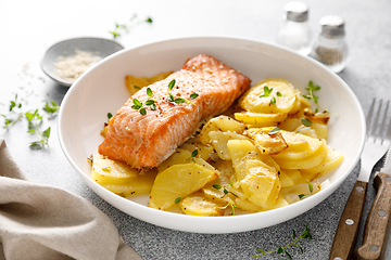 Image showing Salmon grilled and baked potato with onions