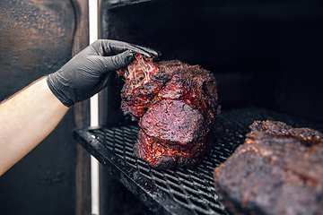 Image showing Meat grilling on the smoker