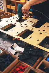 Image showing Worker's hands on a workbench