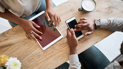 Image showing Hands, tablet and phone with a coffee shop business team working together online closeup from above. Marketing, ecommerce and remote work with a man and woman employee at work in an internet cafe