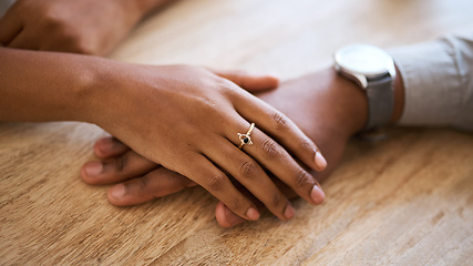 Image showing Couple, hands and support with love and trust zoom against wood table, hand touching with care and comfort. Helping hand, relax and commitment with relationship partnership and solidarity together.