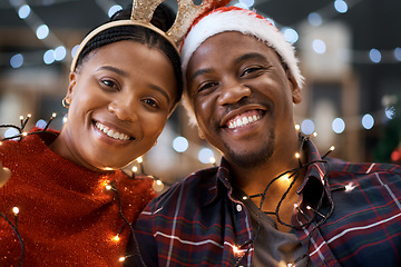 Image showing Christmas, love and portrait of a happy black couple at a festive party celebration with lights. Happiness, smile and African man and woman at xmas holidays event together with traditional decoration