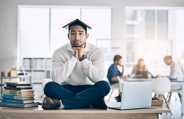 Image showing Business man, books and learning with a frustrated, sad and tired entrepreneur on desk for burnout, stress and anxiety. Portrait of a bored law student and employee in office to study, learn and work