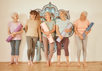 Image showing Yoga class, fitness and senior women training, happy with gym pilates and meditation as a group. Wall, calm and elderly friends at studio for mindfulness, spiritual workout and relax with exercise