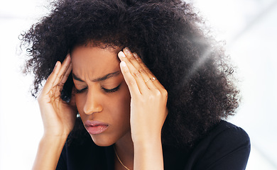 Image showing Headache, stress and burnout with a business black woman struggling with mental health issues while working in her office. Compliance, face and pain with a female employee suffering from a migraine