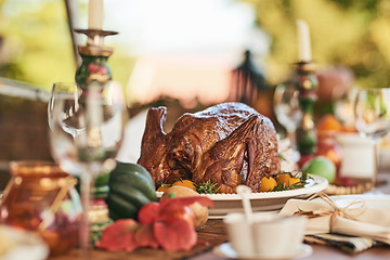 Image showing Thanksgiving turkey, food and table set for lunch outdoors with wine glasses. Champagne glasses, fine dining, and delicious healthy chicken for party, buffet or celebration with luxury meal outside.