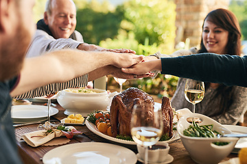 Image showing We all made this day possible. Hands together, food and family celebrate with dinner, party and support, trust and feast for holiday or anniversary celebration.