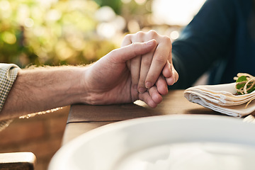 Image showing Couple, holding hands and lunch with praying, love and trust in marriage, hope and care at table outdoor. Man, woman and hand for hope, gratitude and prayer in Christian faith, spiritual or support