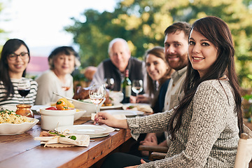 Image showing Family, dinner and party, celebrate with food and smile in portrait with holiday or anniversary together. Dinner party, happy and outdoor feast, table with men and women ready to eat and drink.