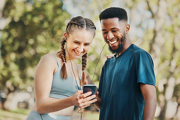 Image showing Phone, music and fitness with a diversity couple streaming audio while running in the park for exercise. Nature, social media and workout with a sports man and woman listening to the radio together