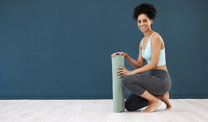 Image showing Yoga, portrait and black woman, mockup and fitness, healthy lifestyle or wellness marketing, advertising space and sports branding. Happy female workout, blank wall and exercise mat in pilates studio