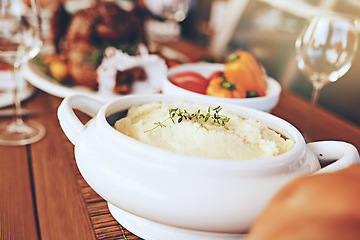 Image showing Food, table and dinner with party to celebrate holiday or anniversary with mashed potato closeup and nutrition. Healthy meal, feast for Christmas or Thanksgiving with celebration and vegetable zoom.