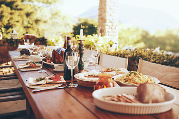 Image showing Food, wine and celebration lunch or dinner for Christmas holiday at outdoor dining table for party or event. Healthy eating, alcohol and nutrition for patio or backyard thanksgiving party background