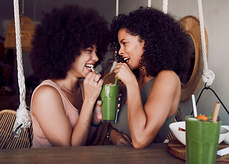 Image showing Friends, woman and drinking smoothie together in cafe, restaurant or date with comic laugh at table. Black women, share or smile with healthy juice, drink or health cocktail for love, bonding or care