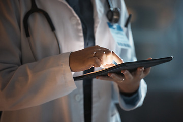 Image showing Doctor hands, tablet and night research in hospital office for online consultation or telehealth app. Schedule, healthcare or female physician on tech, medical news or checking patient record on web