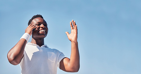 Image showing Nature, phone call communication and black man talking, speaking or chatting. Blue sky, mobile and low angle of male on 5g smartphone in conversation, discussion or networking with contact outdoors.