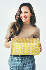 Image showing Gift, portrait and woman with a box in studio for winning a prize, reward or birthday present on a white background. Gift box, congratulations and happy girl with a big smile excited for a package