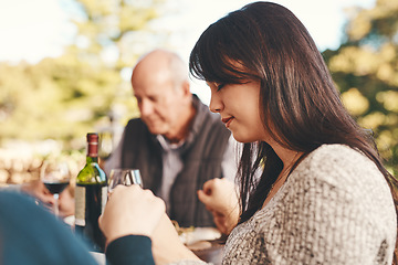 Image showing People, prayer before eating food for bonding, content for lunch and outdoor. Religious gesture, group and holding hands for brunch, family gathering or quality time for break, calm or peaceful