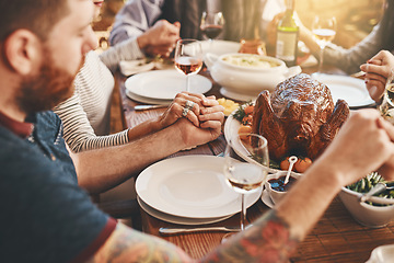 Image showing Chicken, prayer and family holding hands praying for food to God or Jesus on a Christmas holiday party at home. Trust, peace and Christian people in gratitude eating dinner at a social gathering