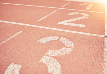 Image showing Sports, athletics and number on race track in stadium for training, sprint and running start position. Texture, ground and running track with nobody for fitness, exercise and workout for sport event