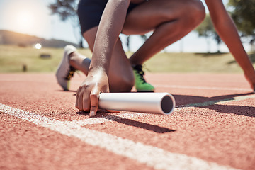 Image showing Stadium, running sports and relay athlete on start track ready for race. Fitness, athletics and black woman with baton preparing for sprint, exercise and workout training for competition outdoors.