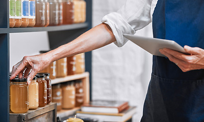 Image showing Hands, tablet and honey jar for inventory check, inspection or pricing at the workplace. Hand of small business owner doing inspection working with touchscreen for product checking at the store