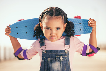 Image showing Summer, skateboard and portrait of girl at beach promenade for sports, attitude and training. Wellness, skater and comic with cool face of child and toys for youth, vacation and seashore lifestyle