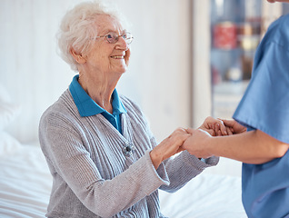 Image showing Elderly woman, nurse holding hands and nursing home support with medical professional exam, retirement healthcare and retired lady. Senior rehabilitation center, hospital worker and consulting doctor