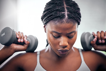 Image showing Black woman, weightlifting dumbbells and gym with focus, strong body or muscle for health, wellness and fitness. African bodybuilder, woman and workout for exercise, weight training and power in club