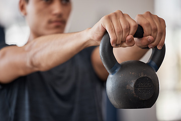 Image showing Man, kettlebell and weightlifting hands in closeup at gym for training, exercise or health with focus. Bodybuilder, strong and workout for healthy body, wellness or muscle development for fitness