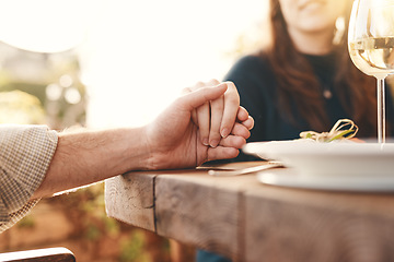 Image showing Worship, table and people holding hands to pray for the meal, feast or dinner at an event. Prayer, celebration and christian family praying for the food before eating at party, celebration or banquet