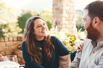 Image showing Happy couple, talking and outdoor on patio for a funny conversation while eating breakfast or lunch in summer. Woman and man together for happiness, love and care while laughing to relax on vacation