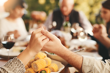 Image showing People, praying for eating and food for bonding, quality time for lunch and outdoor. Religious gesture, group and holding hands for brunch, family gathering and content for break, calm and peaceful.