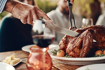 Image showing Man cut turkey, chicken and food for thanksgiving, christmas and family lunch, dinner table setting or party, celebration and meal in home. Hands, knife and carving meat, poultry and feast for dining