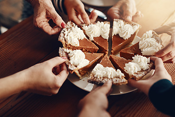 Image showing Cake, celebration and hands of family at a party for Christmas lunch together in a house. Food, sharing and friends with pie for dessert after Thanksgiving dinner during the holiday in a family home