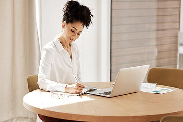 Image showing Woman writing in notebook, laptop on table and home office of accountant, auditor or financial advisor. Finance report, strategy and budget planning, black woman doing research on tax audit documents