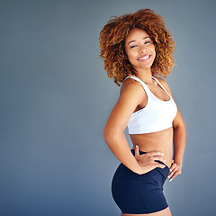 Image showing Sports, beauty and portrait of confident black woman with happy face and mockup on blue background. Fitness, health and wellness, woman with afro with smile, motivation and healthy mindset in studio.