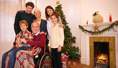 Image showing Portrait, Christmas and family celebrate holiday together, grandparents, parents and child smile in family home. Christmas tree, fireplace and generations, love and tradition with happy family.